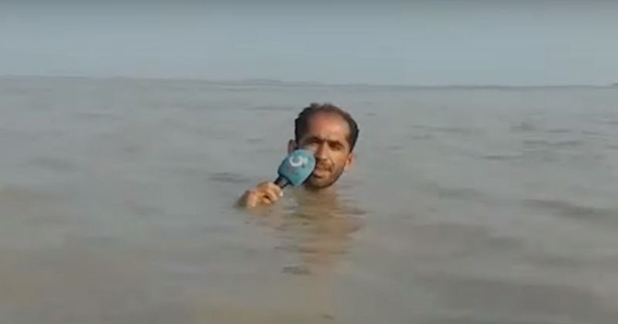 Watch: Pakistani Journalist Stands in Neck-Deep Water To Report About Floods in Hilarious Video!